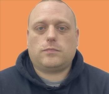 man in front of orange background