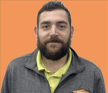 man in front of orange background