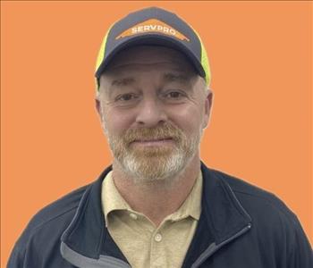 man in front of orange background