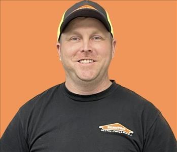 man in front of orange background