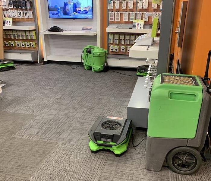 Green air movers on the carpet floor. 