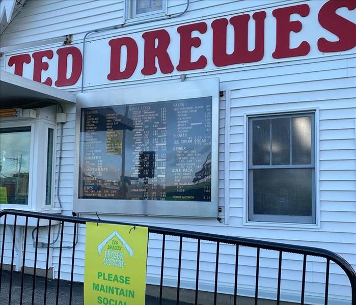 Ted Drewes with a Certified: SERVPRO Cleaned sign.