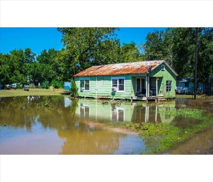 Home surrounded by flood waters